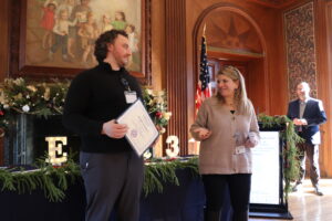 Joseph Senatore receives his Employee of the Quarter certificate from Denise Gaughan