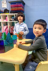 Students play with toys during Preschool Exchange