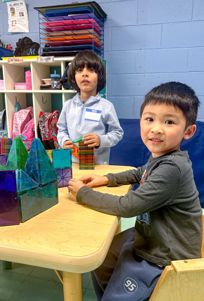 Students play with toys during Preschool Exchange