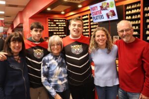 Noah Blumberg, his brother and his other family members at the bowling alley
