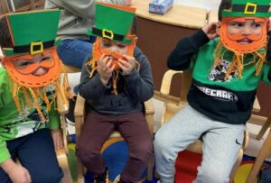 Three Post Avenue Students dressed up as leprechauns for St. Patrick's Day